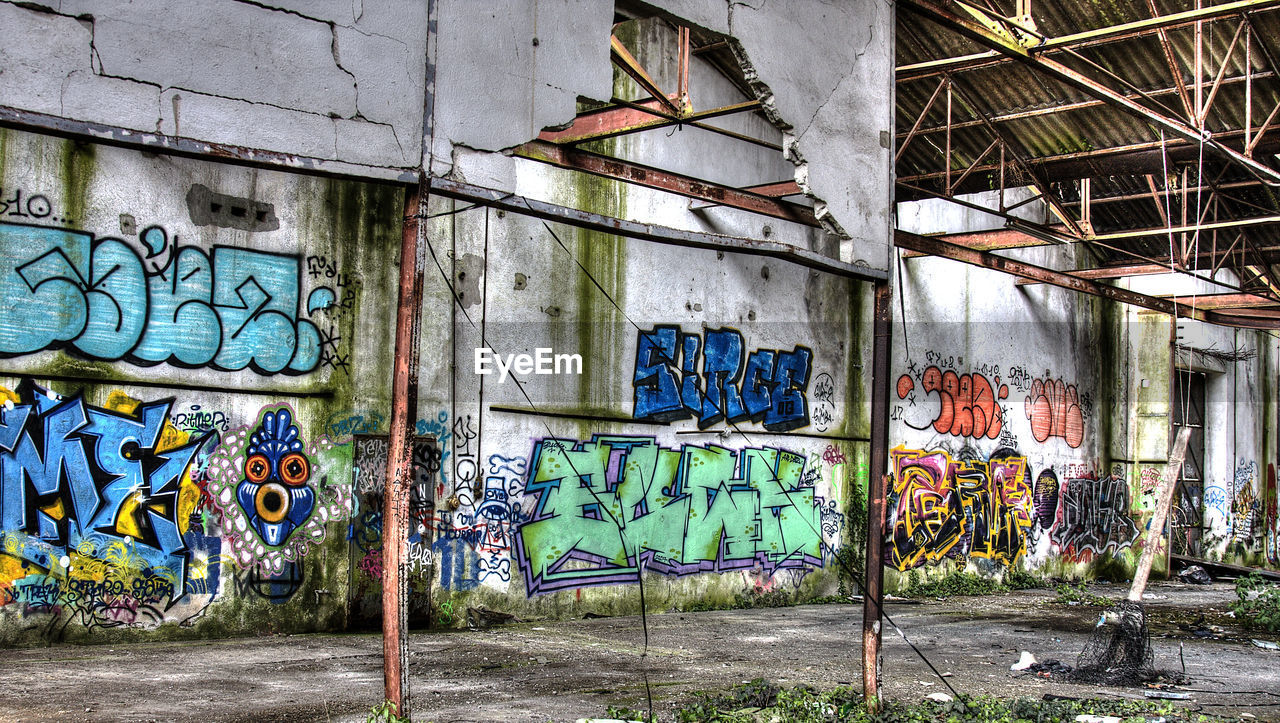 GRAFFITI ON ABANDONED BUILT STRUCTURE