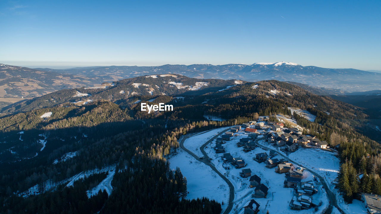 High angle view of snowcapped mountains against sky