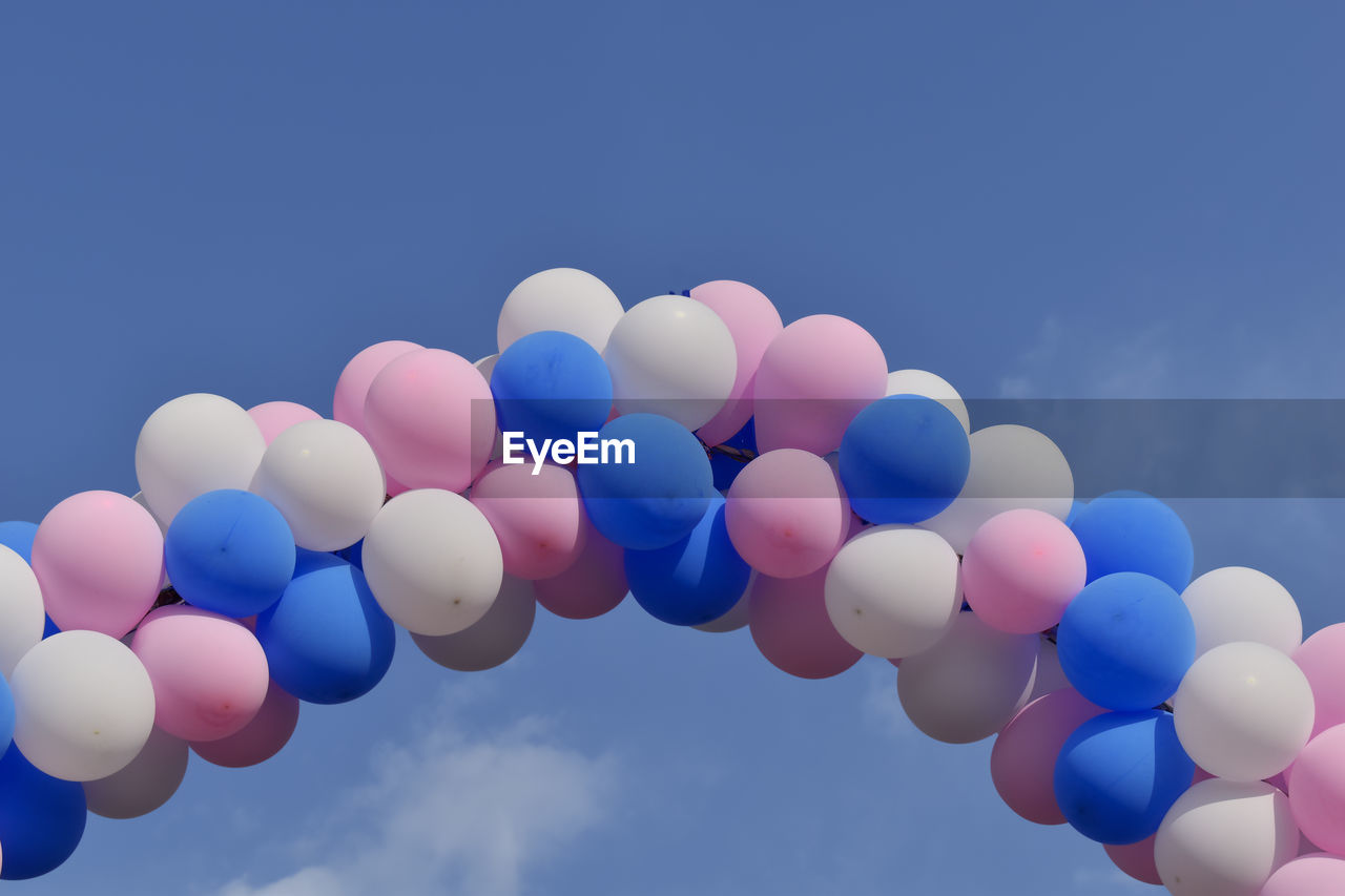 Image of some colorful balloons on the blue sky background.