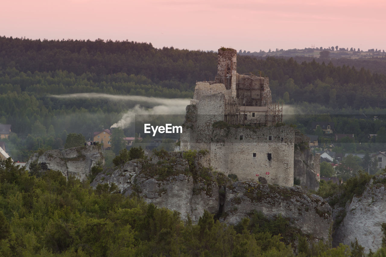 Castle on mountain against sky