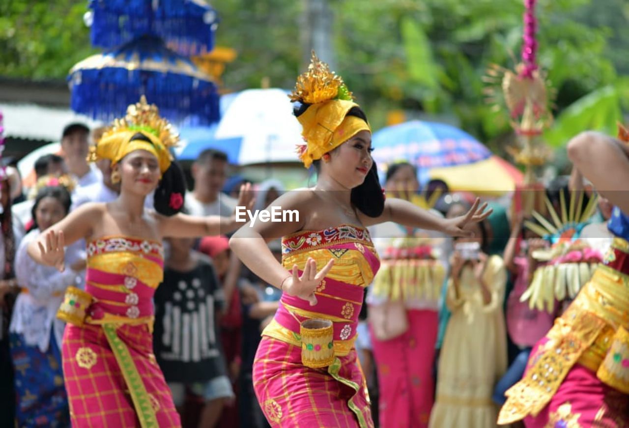 GROUP OF PEOPLE IN TRADITIONAL CLOTHING