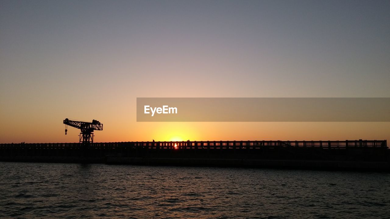 Scenic view of sea against sky at sunset