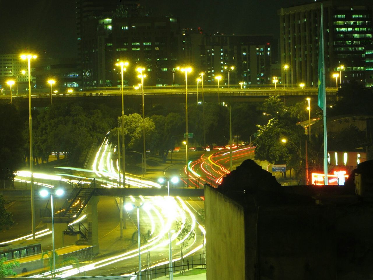 High angle view of light trails on city street at night