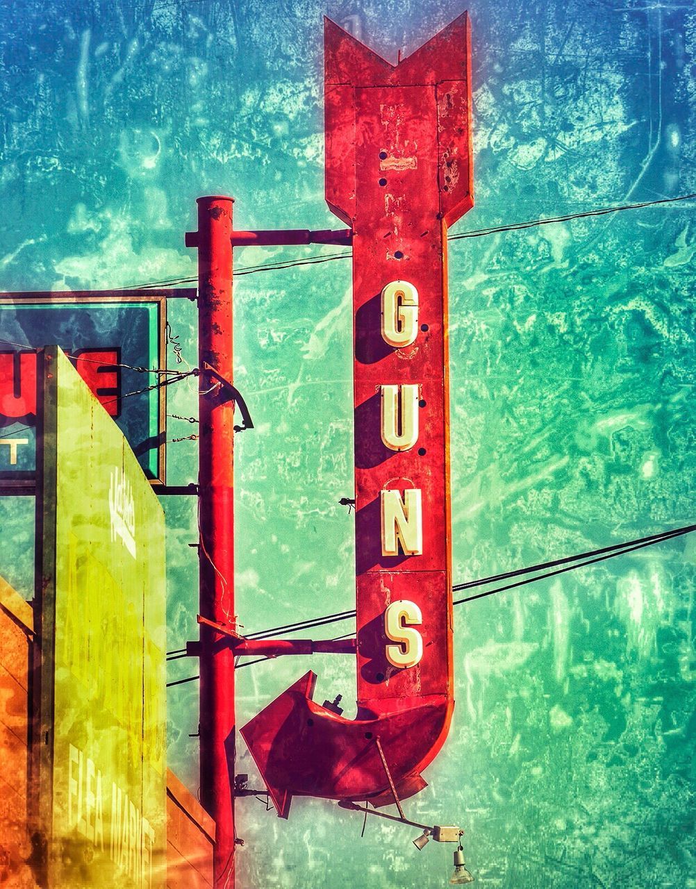 CLOSE-UP OF RUSTY SIGN AGAINST SKY