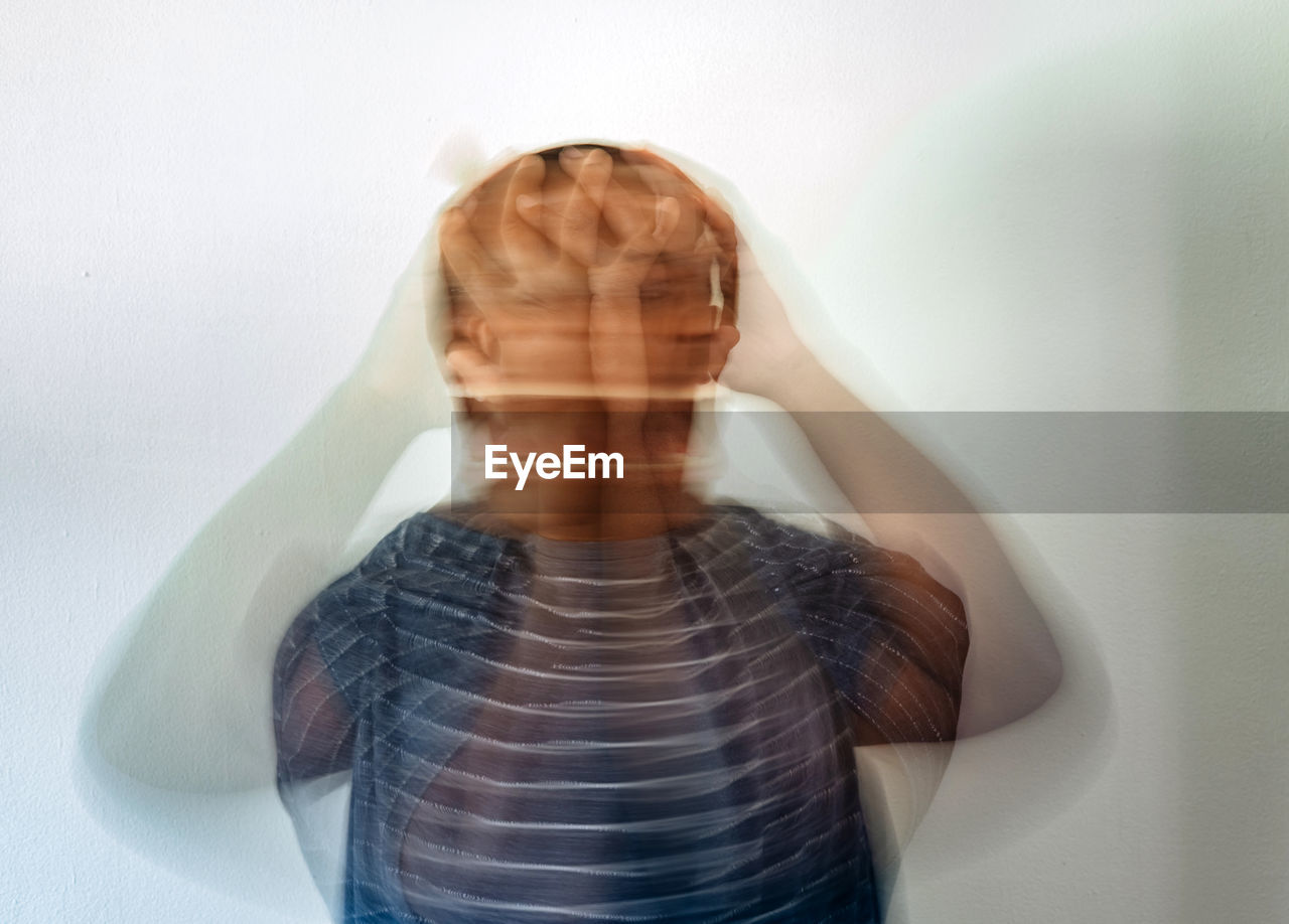 Man in anguish and pain mental health concept showing black or african american man stressed