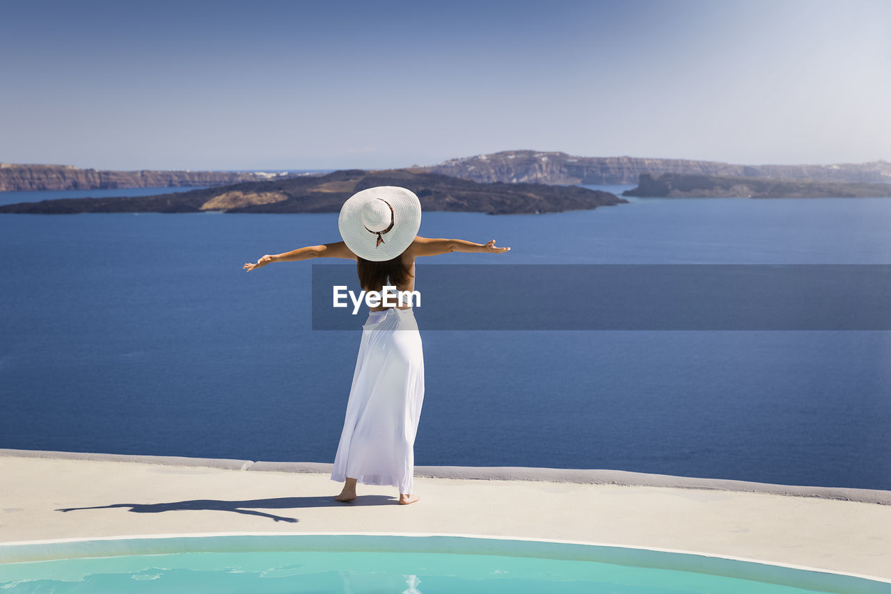 Rear view of woman looking at sea