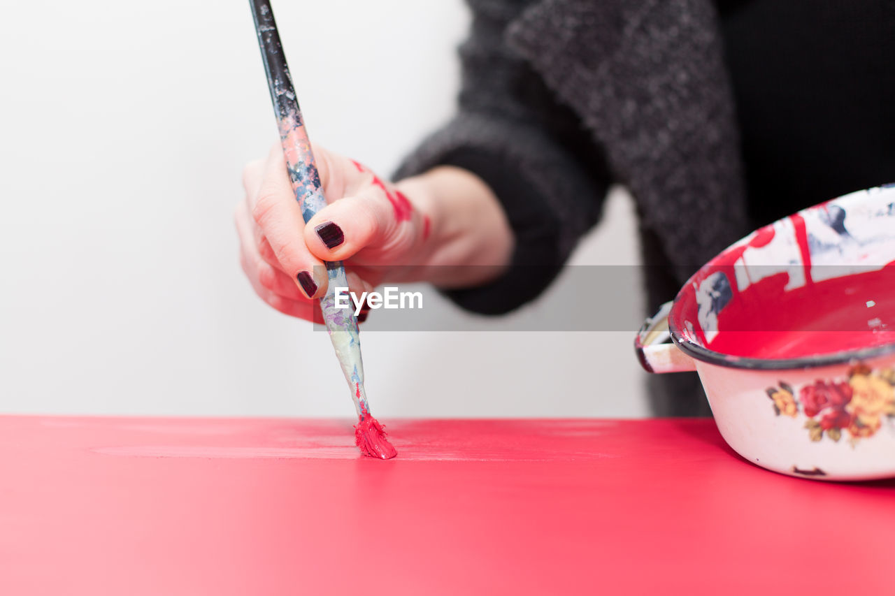 Close-up of woman using paintbrush