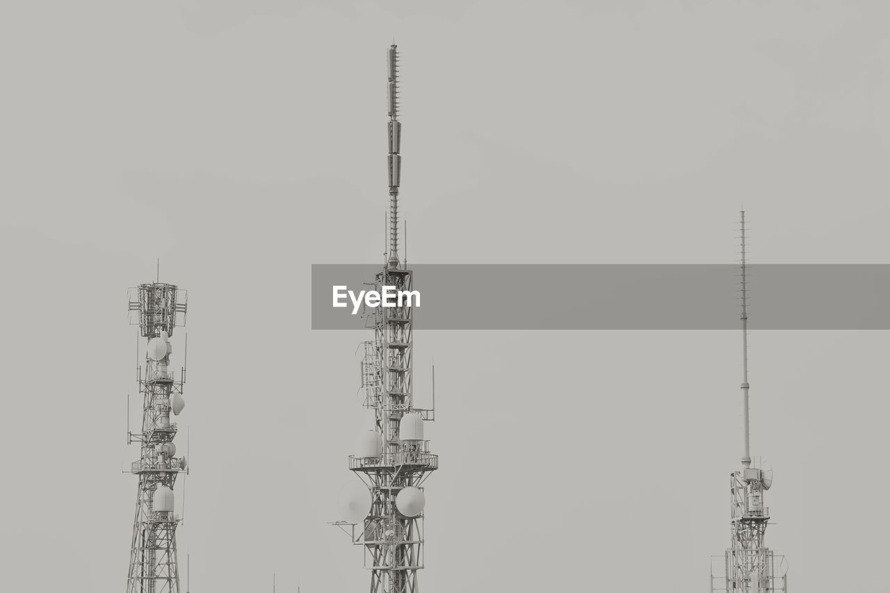 electricity pylon against clear sky