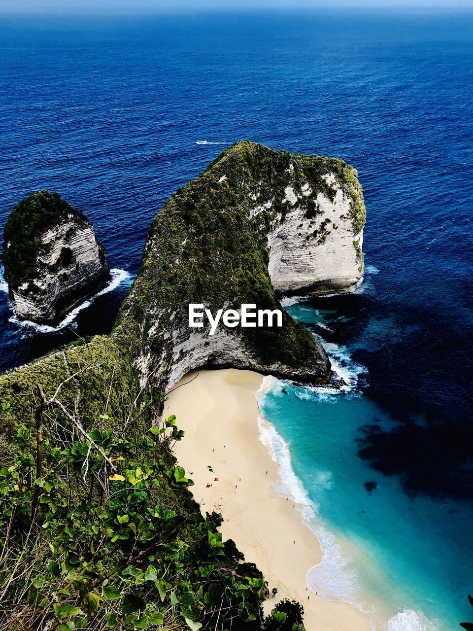 High angle view of rocks on sea shore