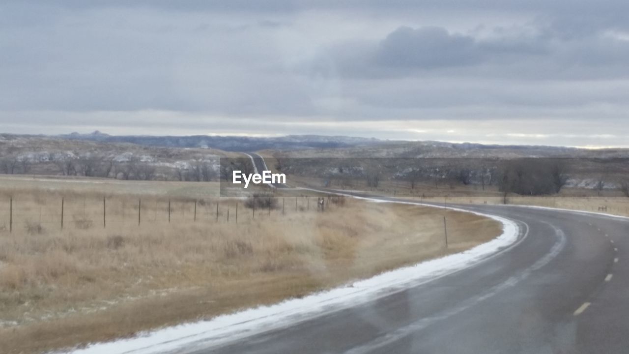 ROAD ON LANDSCAPE AGAINST SKY