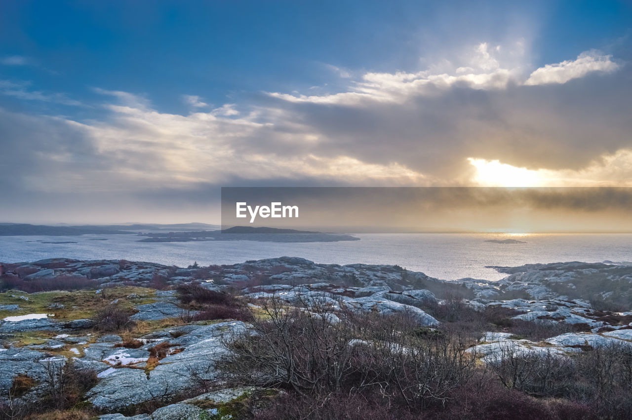 Scenic view of sea against sky at sunset