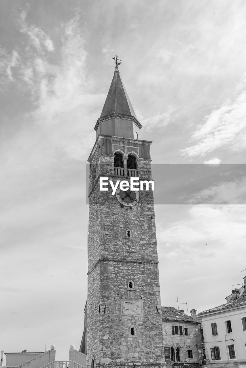 LOW ANGLE VIEW OF BELL TOWER AGAINST CLOUDY SKY