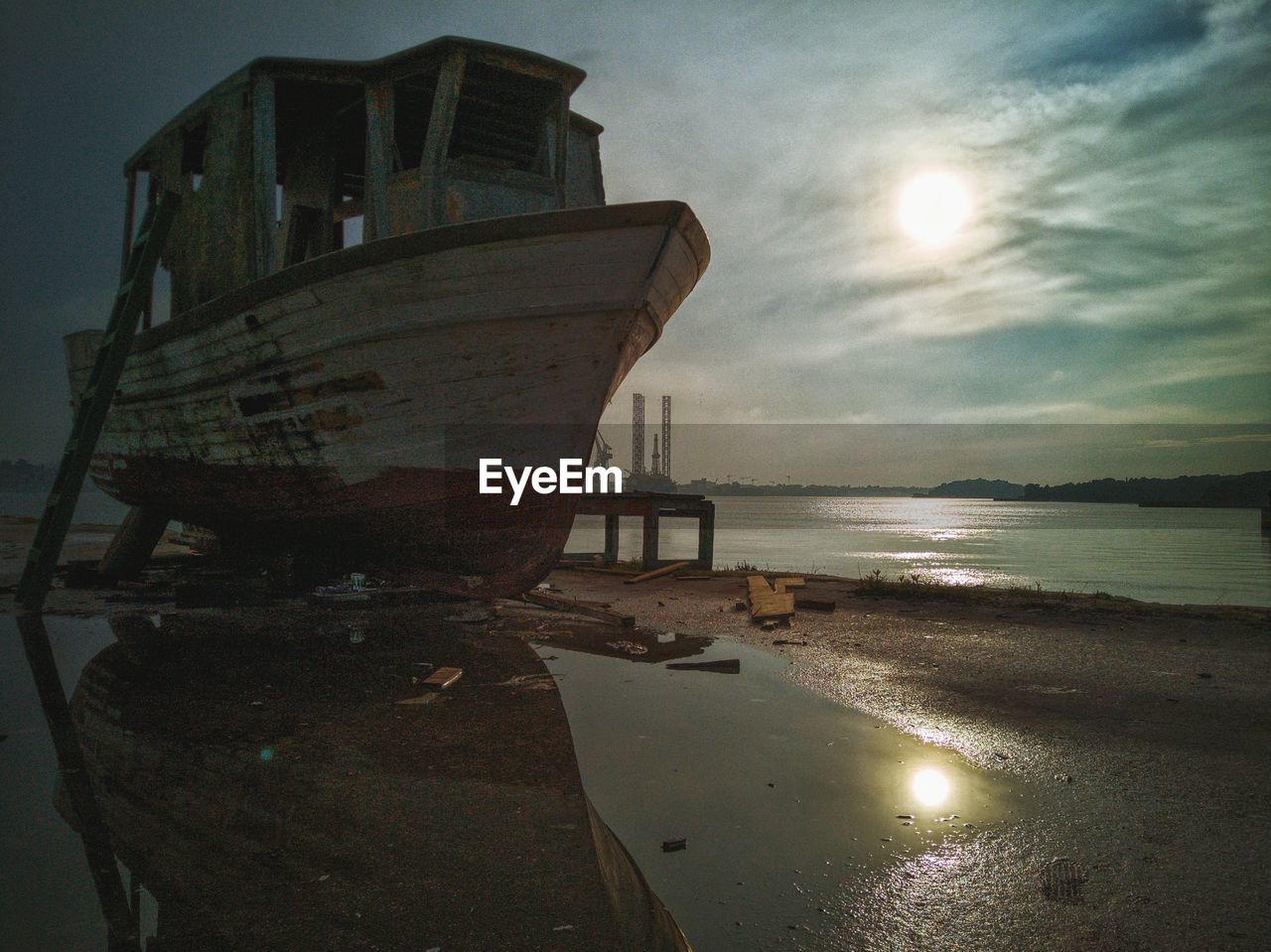 VIEW OF BOAT MOORED AT BEACH