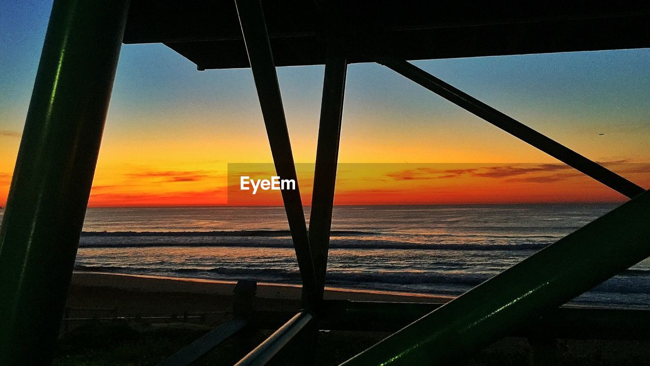 Scenic view of sea against sky at sunset