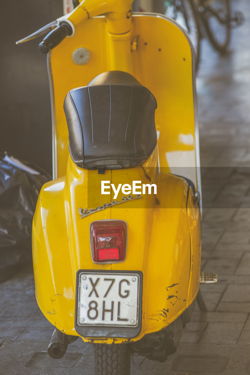 CLOSE-UP OF YELLOW TEXT ON CAR