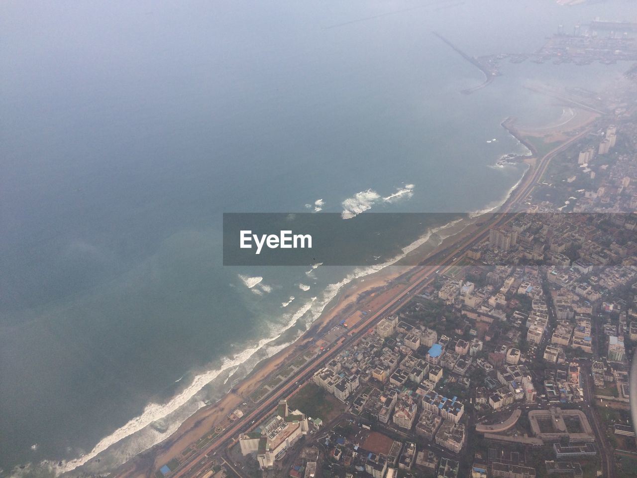 Aerial view of cityscape and sea