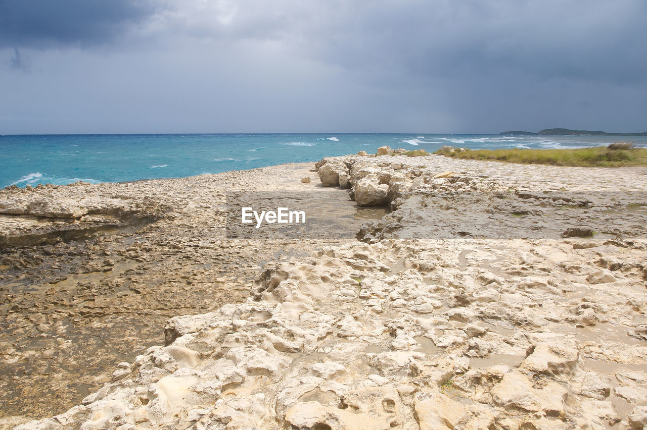 BEACH AGAINST SKY