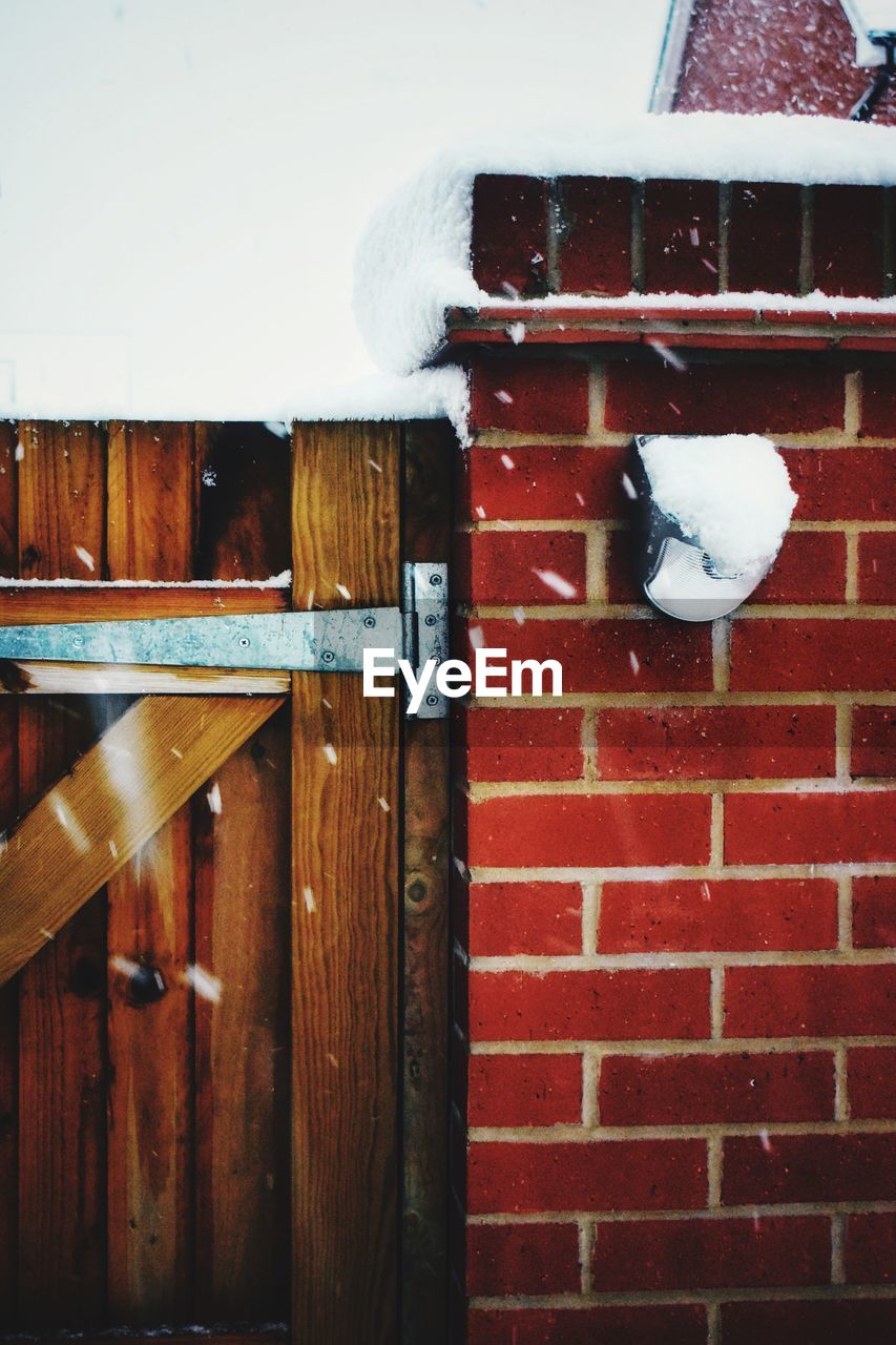 SNOW ON HOUSE WALL