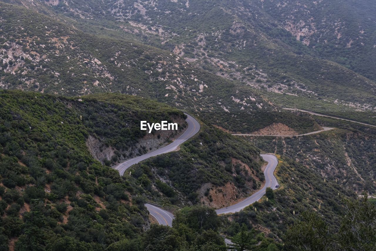 HIGH ANGLE VIEW OF MOUNTAIN ROAD