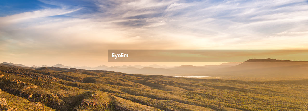 Scenic view of landscape against sky during sunset