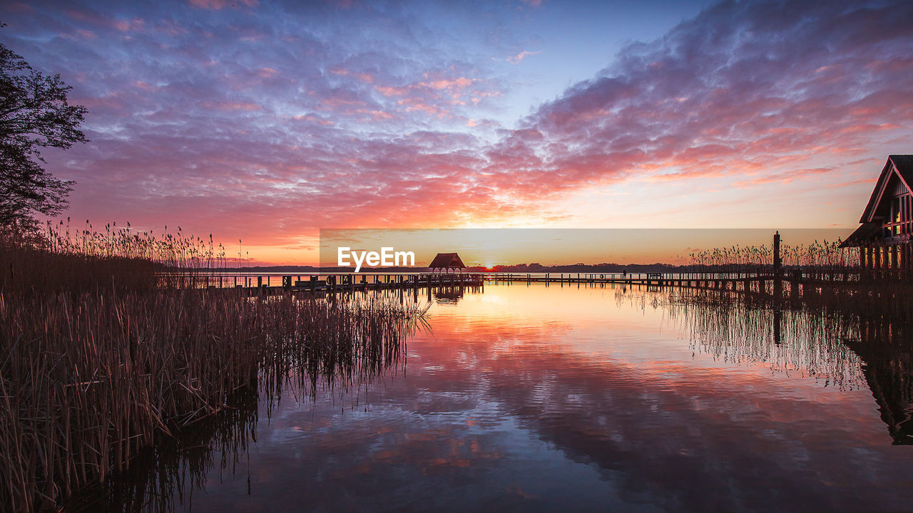 Scenic view of lake against sky during sunset