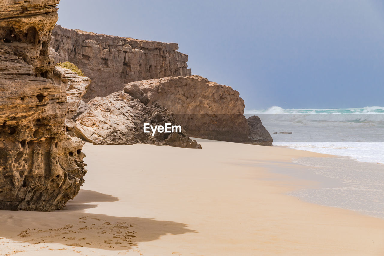 Striking bizarre rocks at praia da varandinha on the atlantic island of boa vista, cape verde