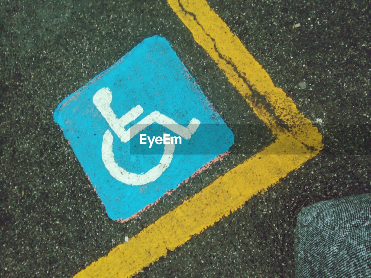 High angle view of disabled sign on street