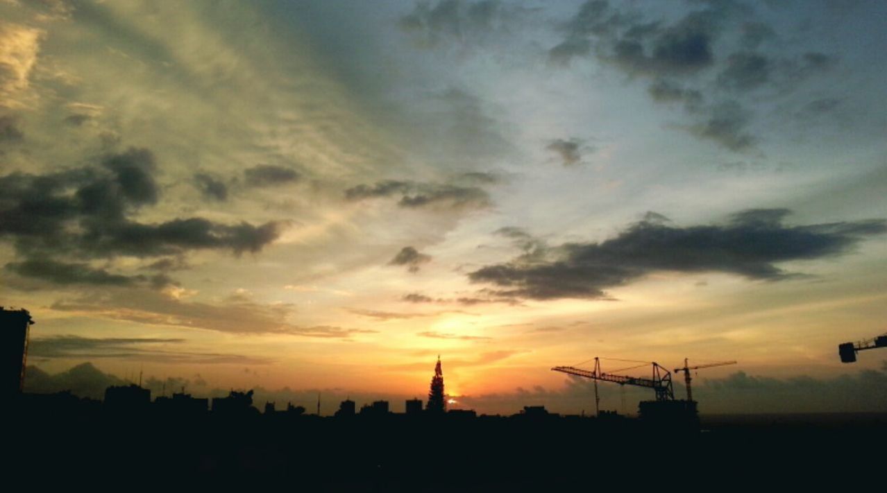 SILHOUETTE OF BUILT STRUCTURES AT SUNSET