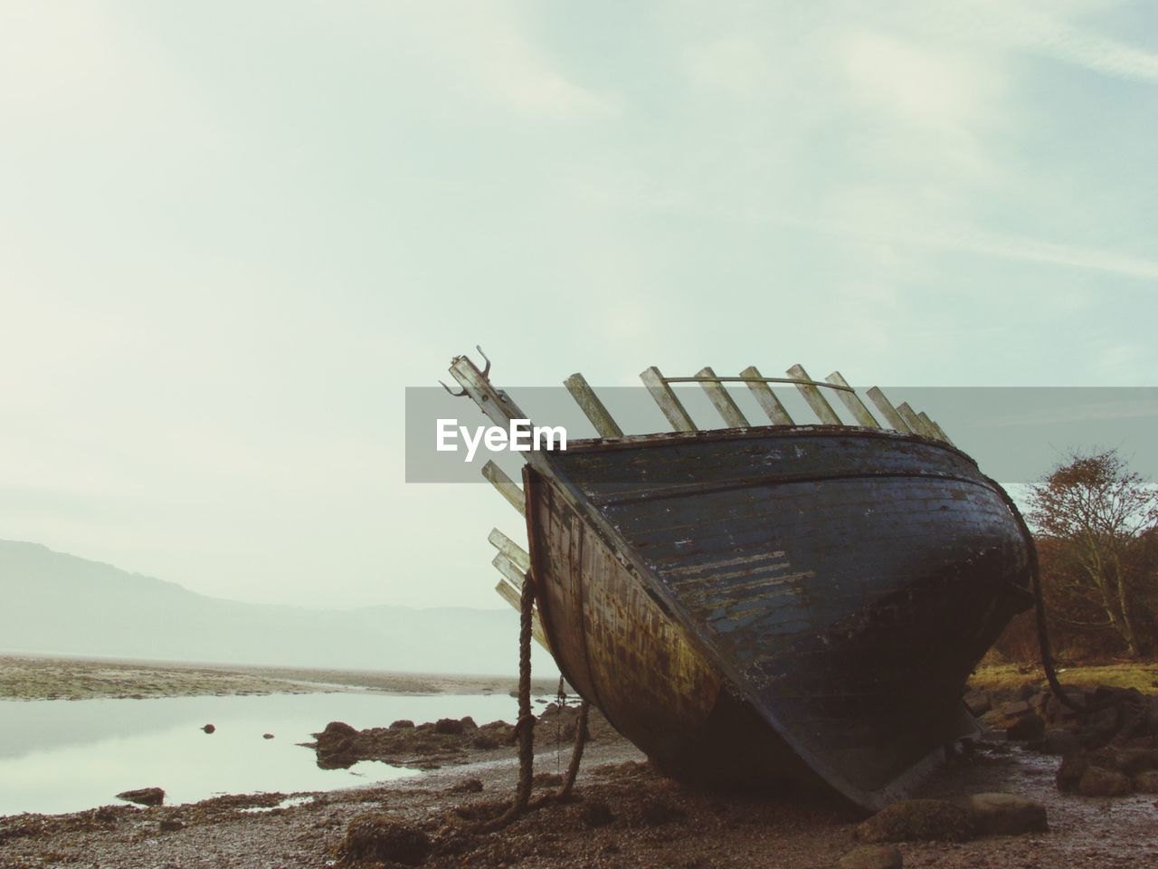 Slanted boat on beach