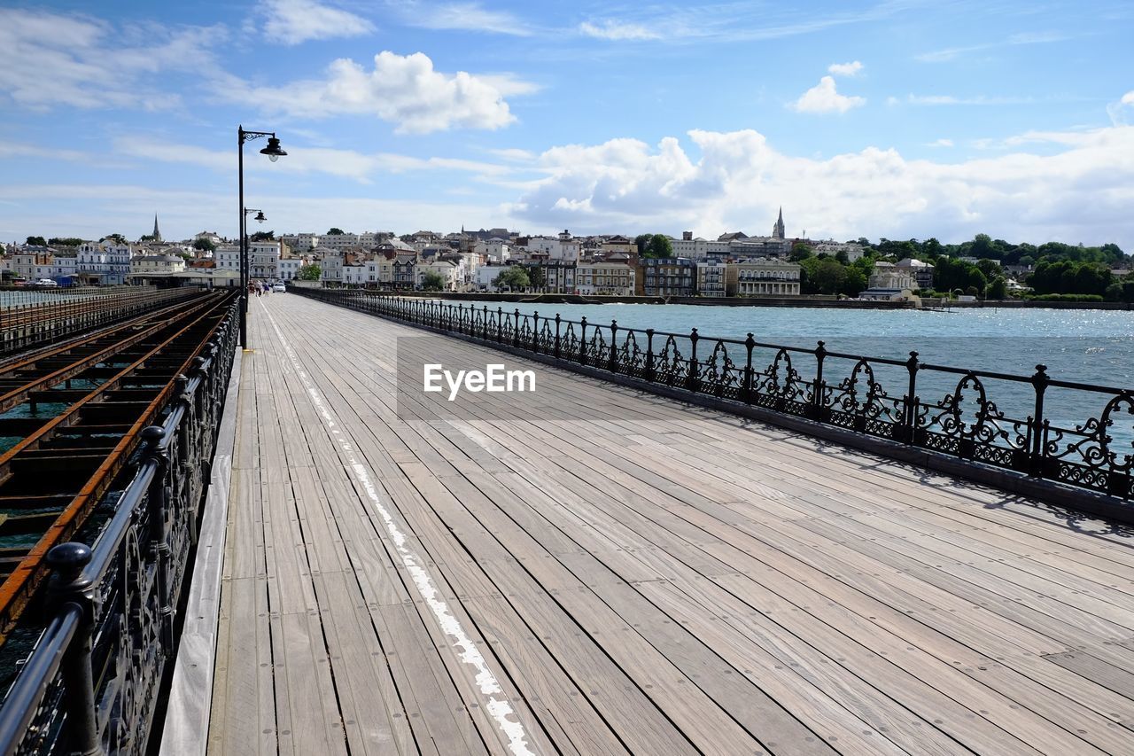 View of bridge in city against sky