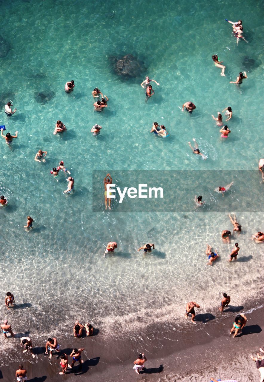 High angle view of people enjoying summer at sea