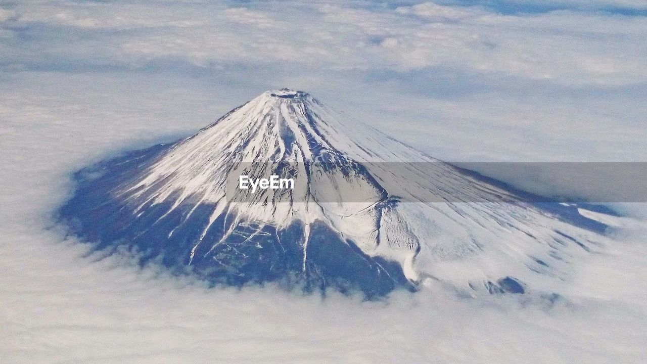 Close-up of snow covered landscape against the sky