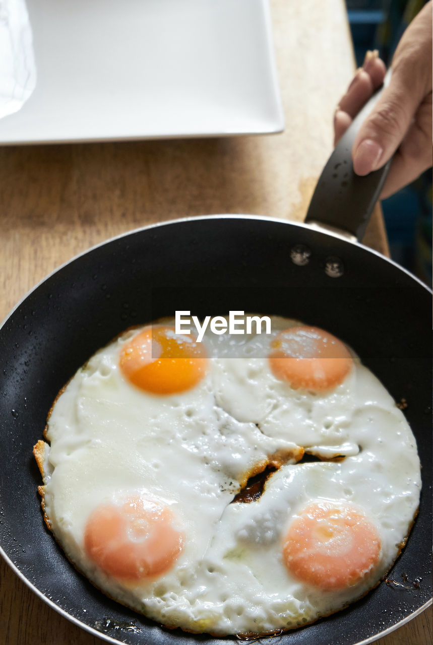 High angle view of fried egg in frying pan