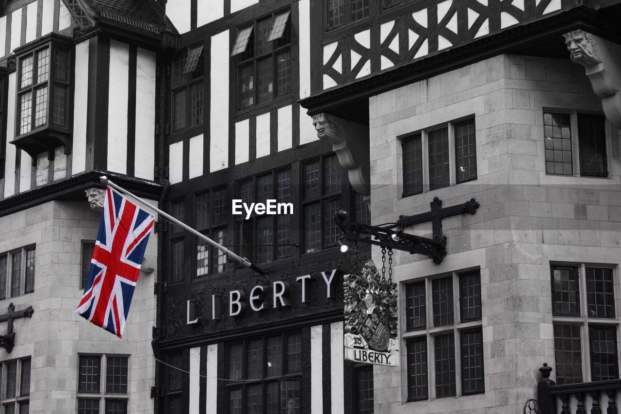 CLOSE-UP OF FLAG AGAINST BUILDING