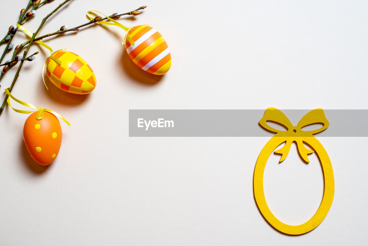 yellow, food, studio shot, food and drink, orange, holiday, no people, celebration, fruit, indoors, white background, still life, jewellery, copy space, decoration, tradition, healthy eating, citrus fruit