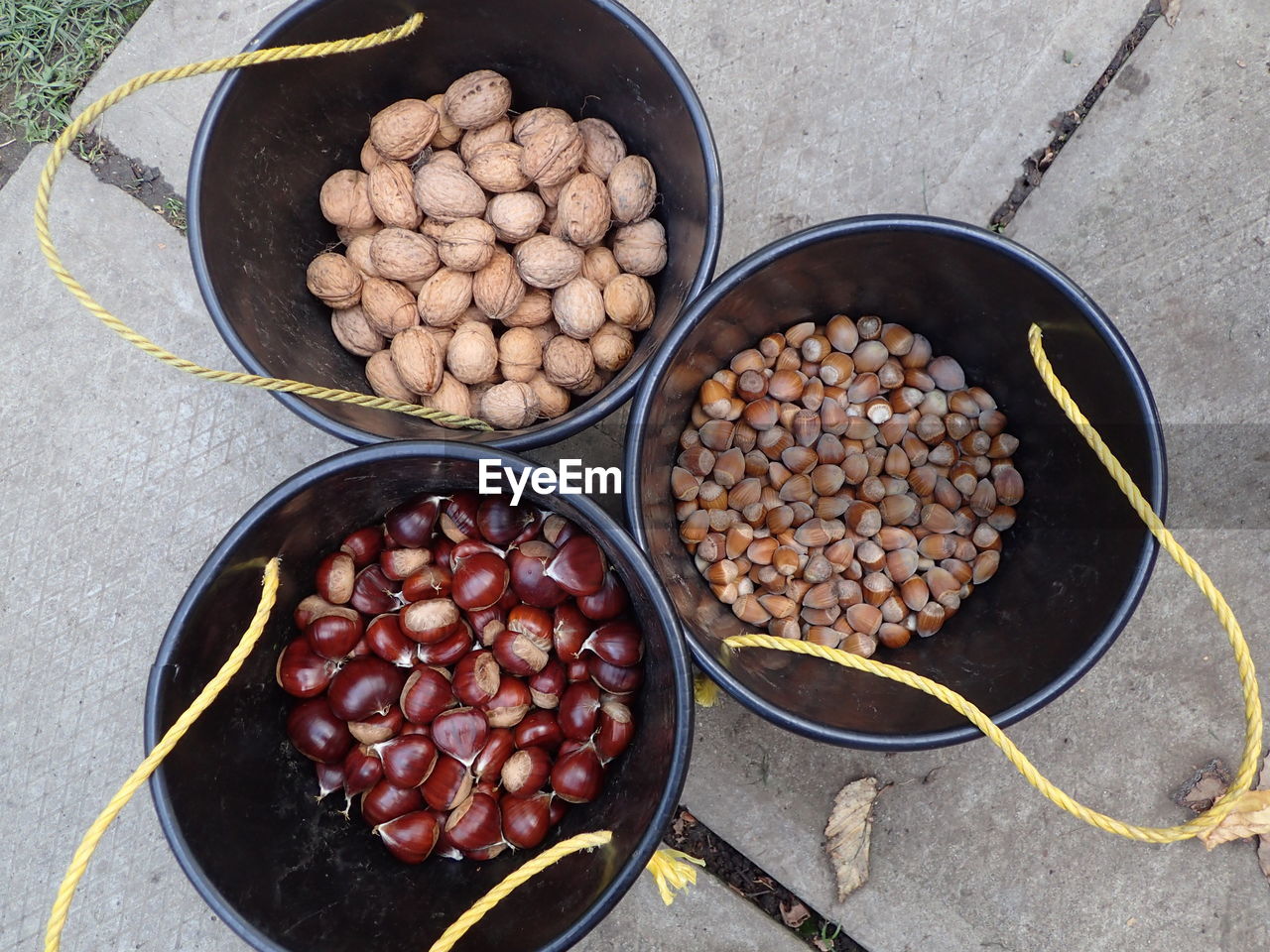 Directly above shot of various nuts in plastic buckets