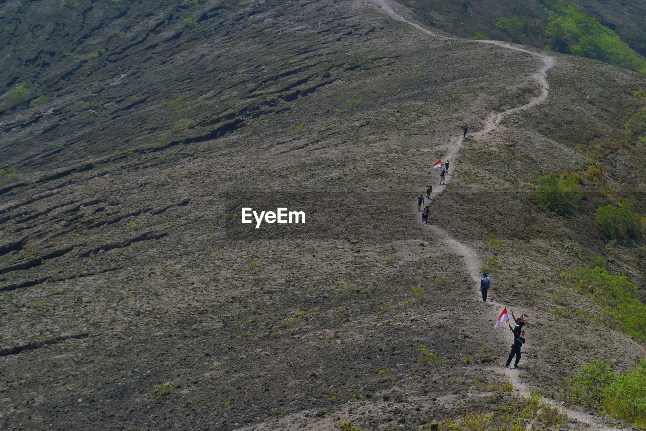 High angle view of people walking on mountain