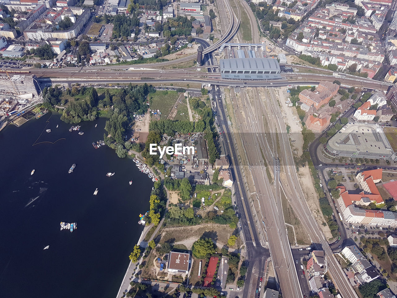 HIGH ANGLE VIEW OF CITYSCAPE BY ROAD