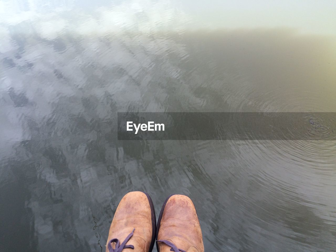 High angle view of person standing in water