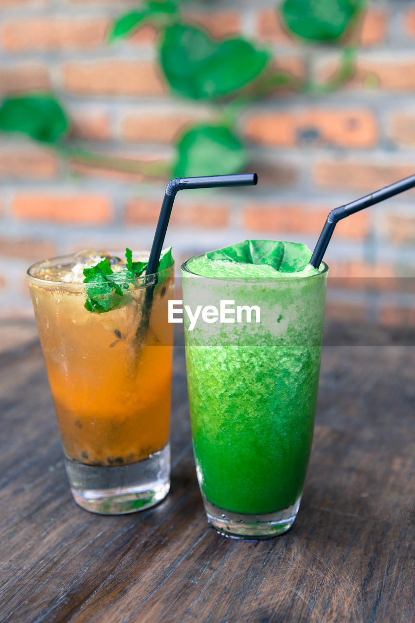 Green and orange fresh smoothies. detox summer drinks