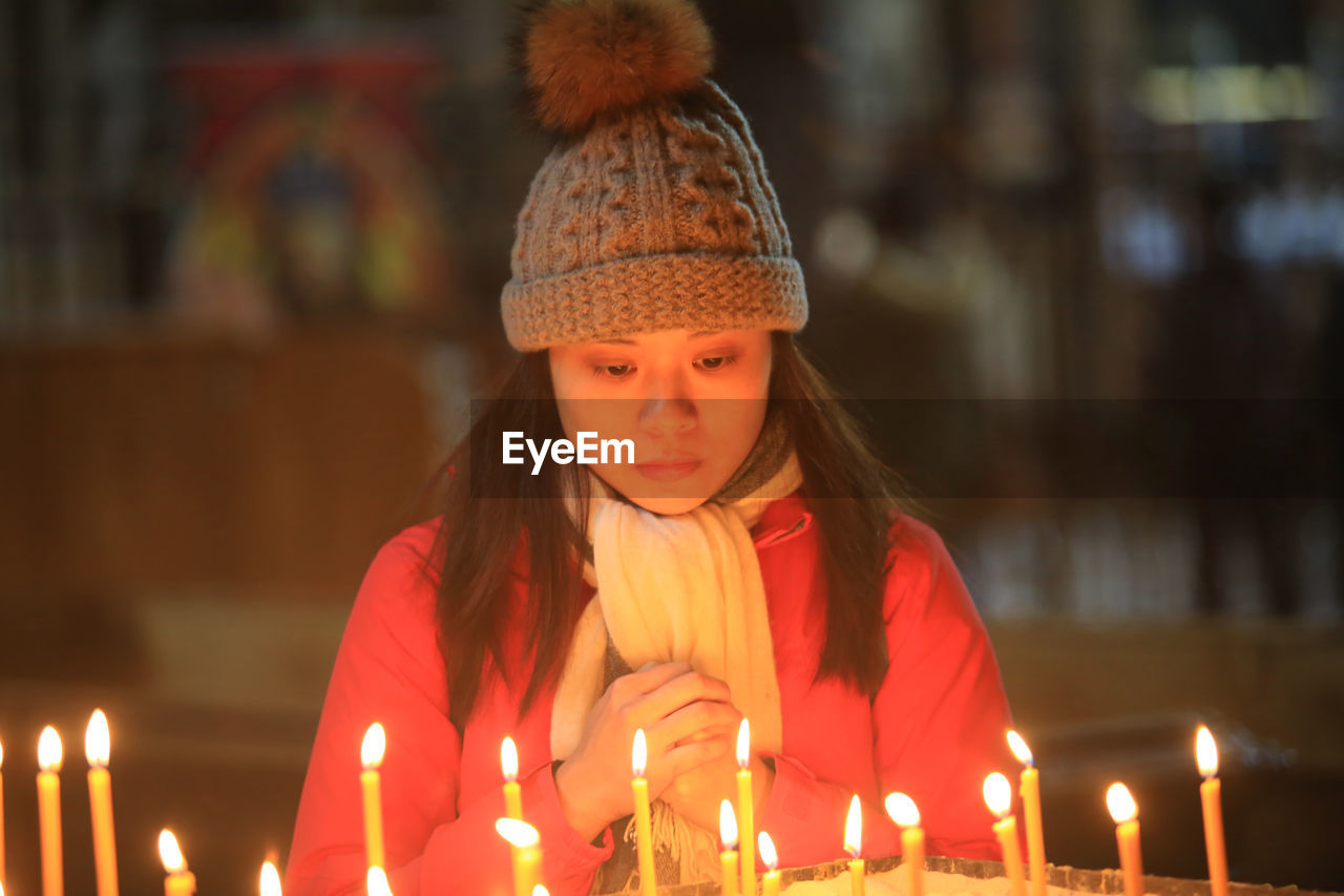 Young woman praying at church