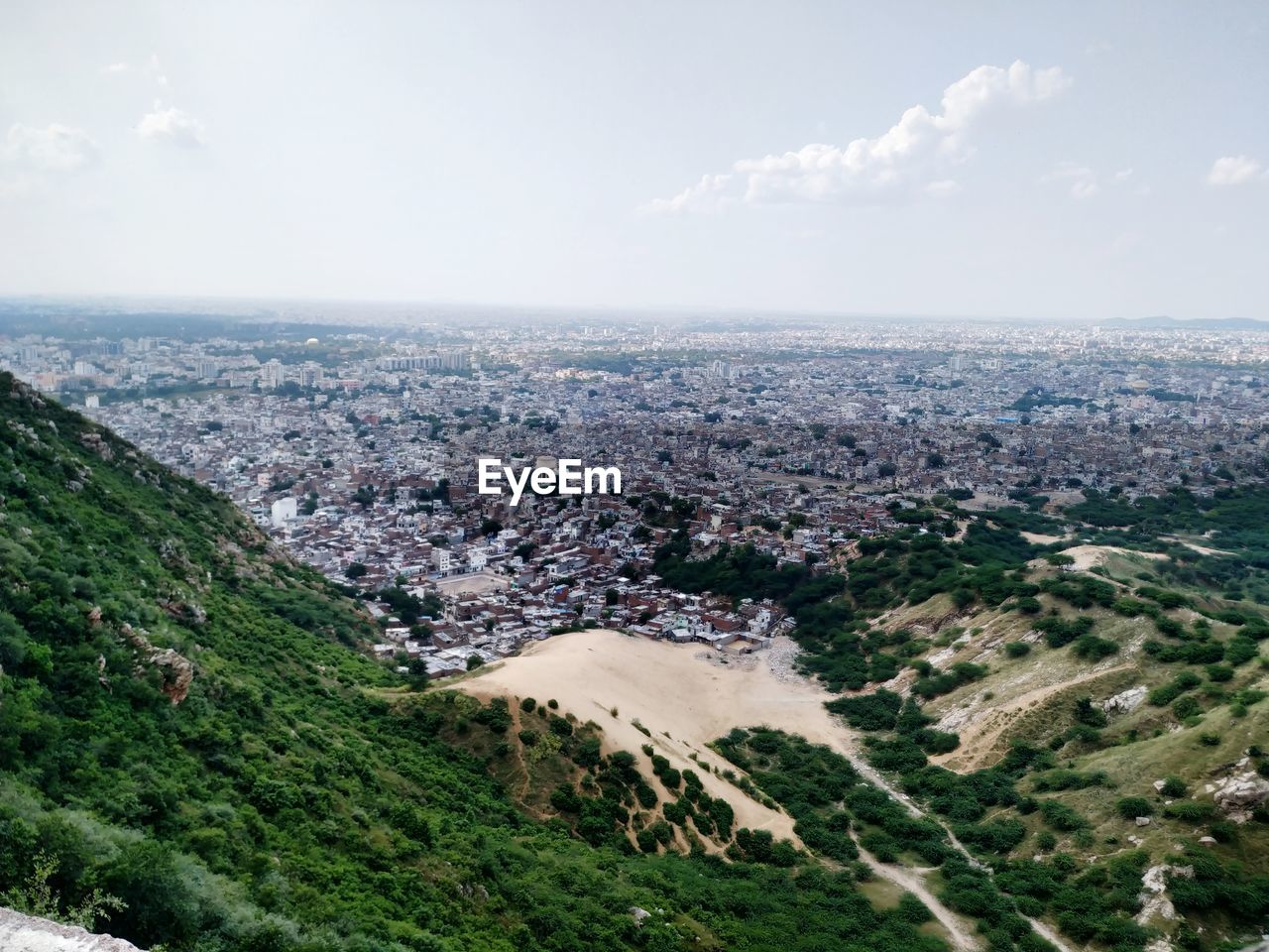 High angle view of buildings in city against sky. 