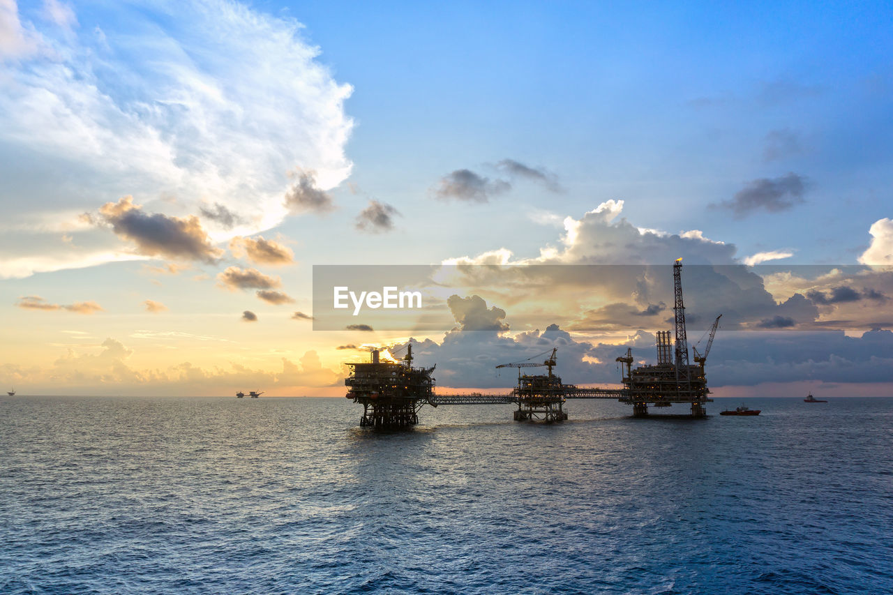 Silhouette of an oil production platform during sunset at offshore terengganu oil filed