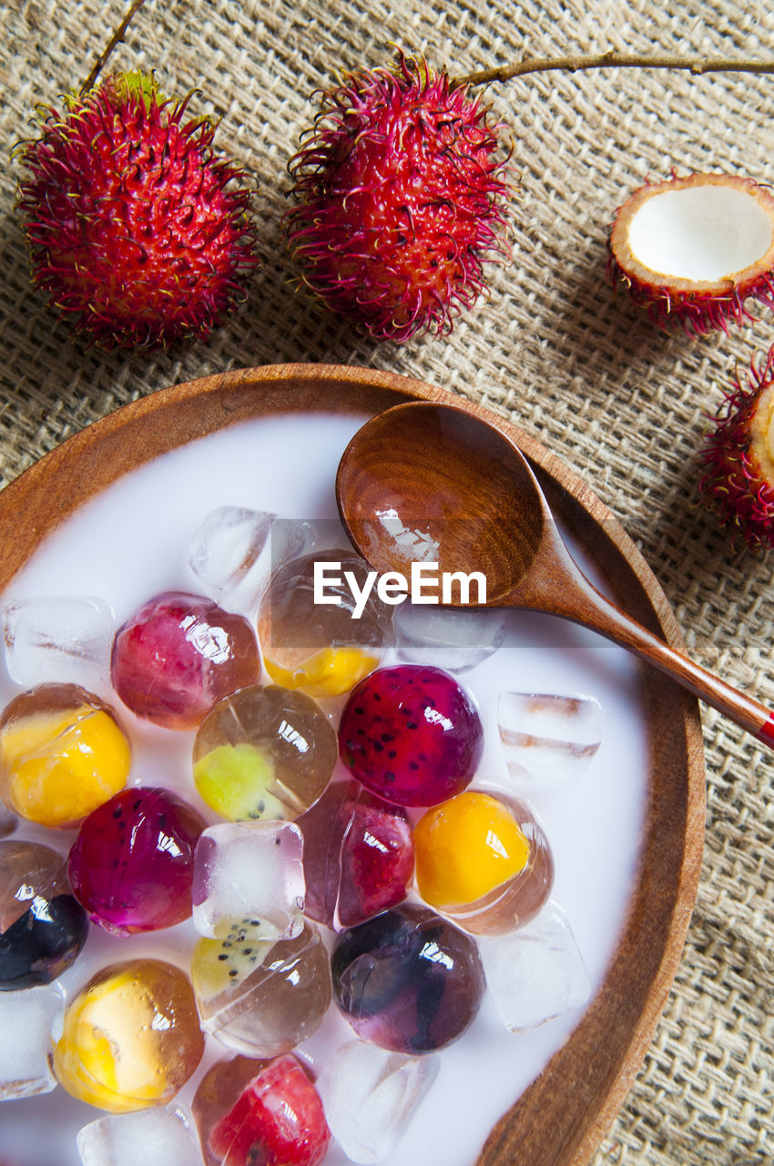 Directly above shot of fruit jelly dessert served in plate on table