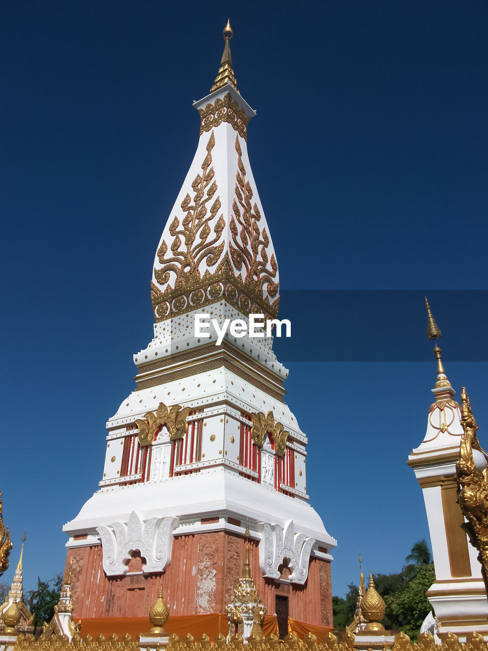 Low angle view of temple against clear blue sky