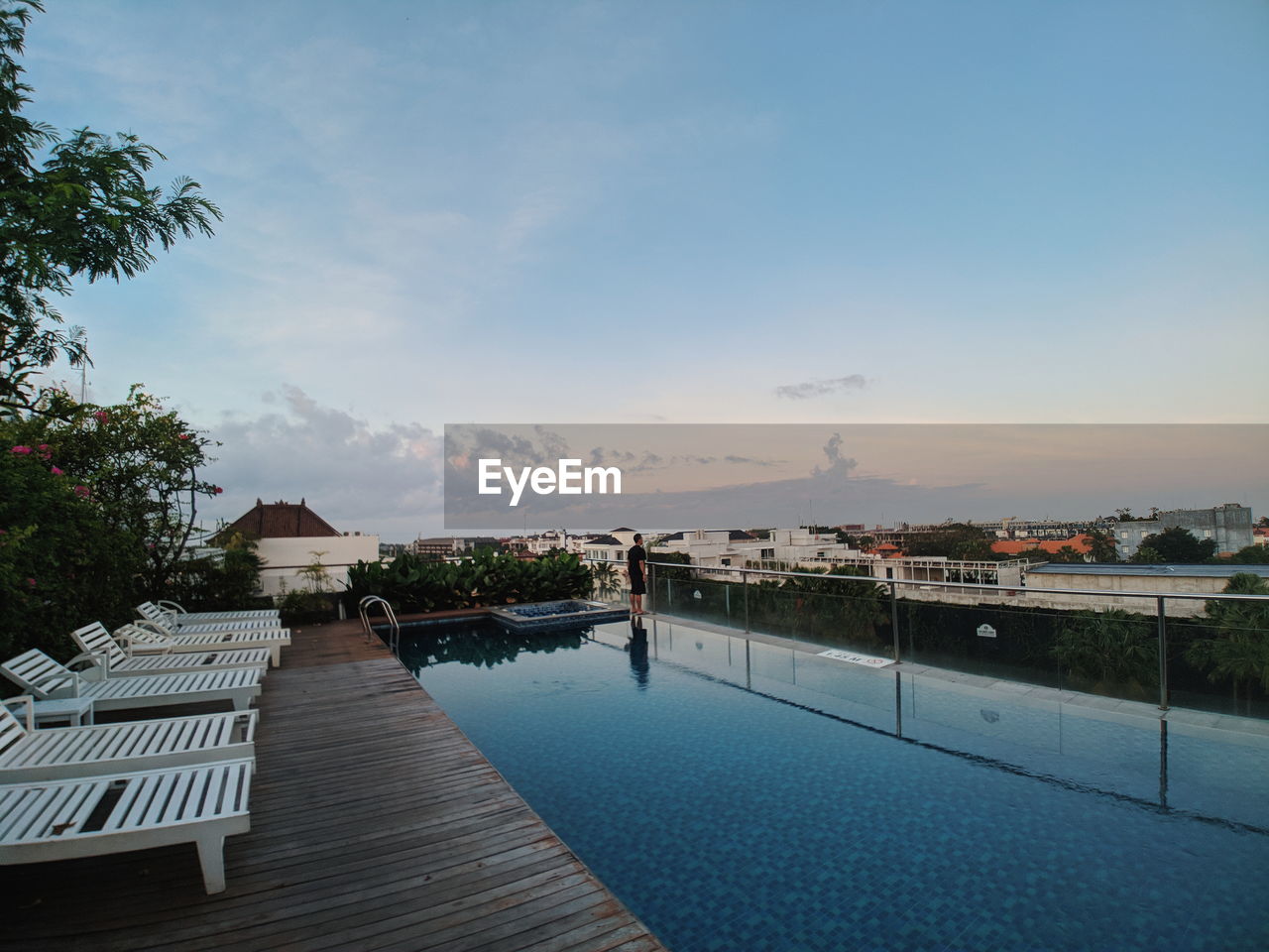 SWIMMING POOL BY BUILDING AGAINST SKY