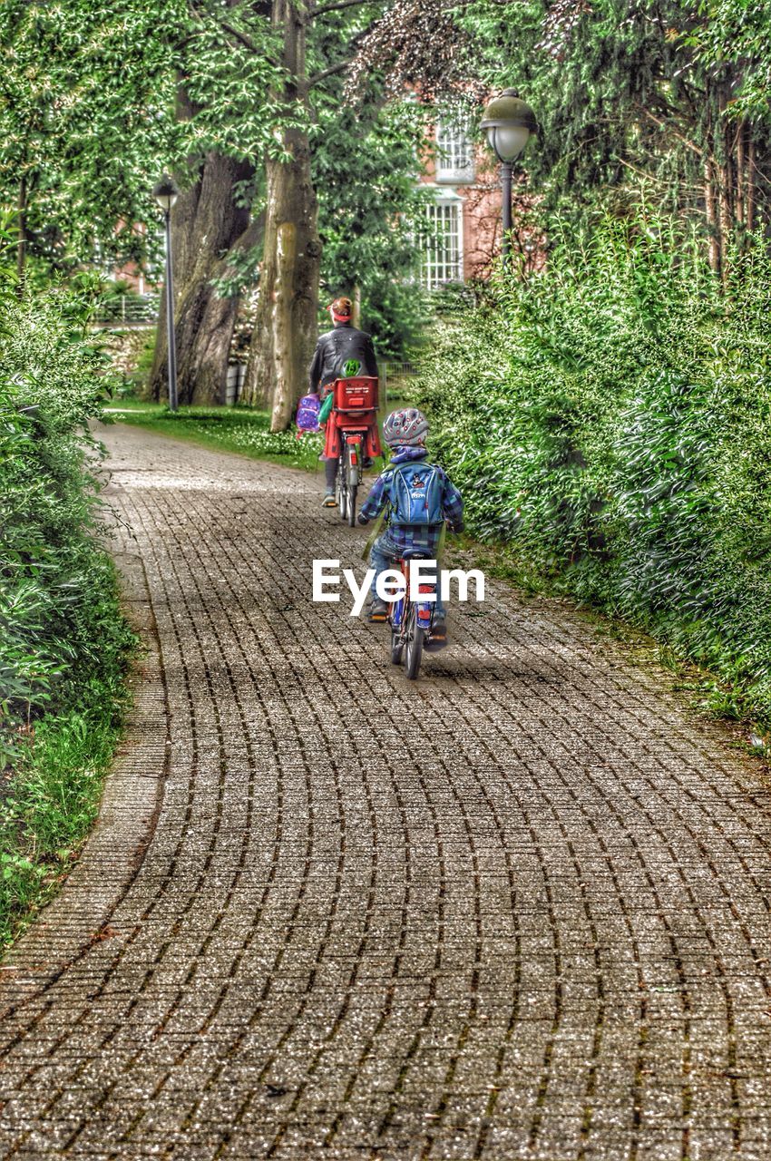 WOMAN WALKING ON FOOTPATH