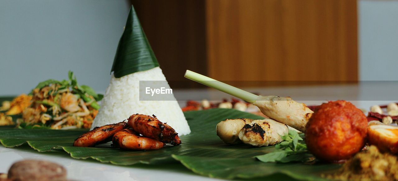 Close-up of food on banana leaf