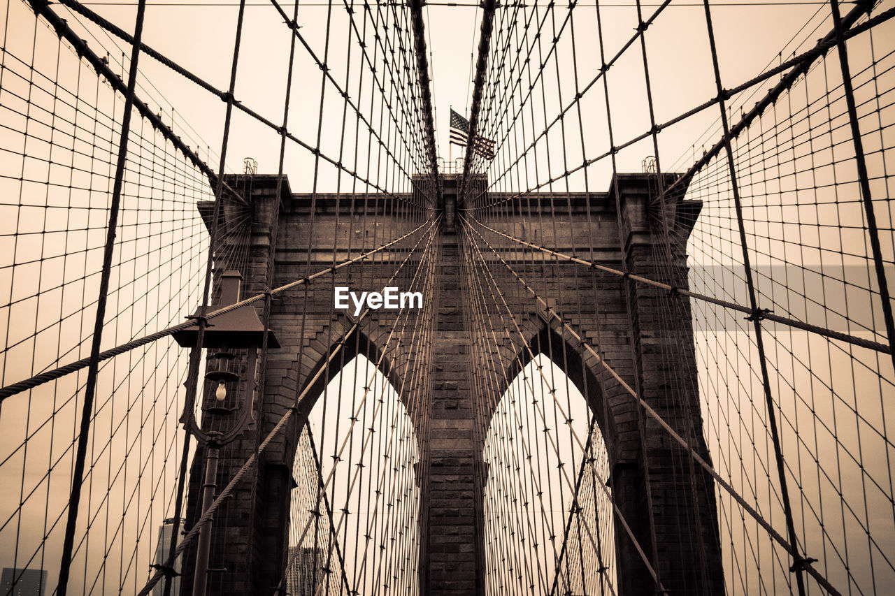 Low angle view of brooklyn bridge against sky