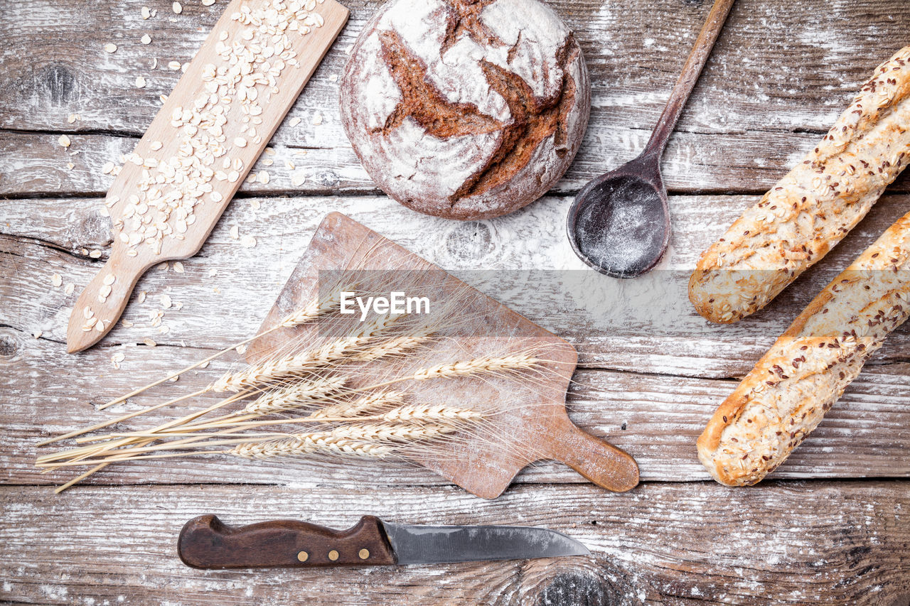 HIGH ANGLE VIEW OF BREAD ON TABLE AGAINST WALL